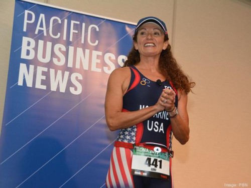 At the end of my presentation, I "transitioned" to my Team USA Tri Kit before running off stage.  It was sorta scary to make this change outside of an event and I didn't know how the audience would take it.  But, I thought it would be memorable if nothing else!  Photo by Tina Yuen, PBN.